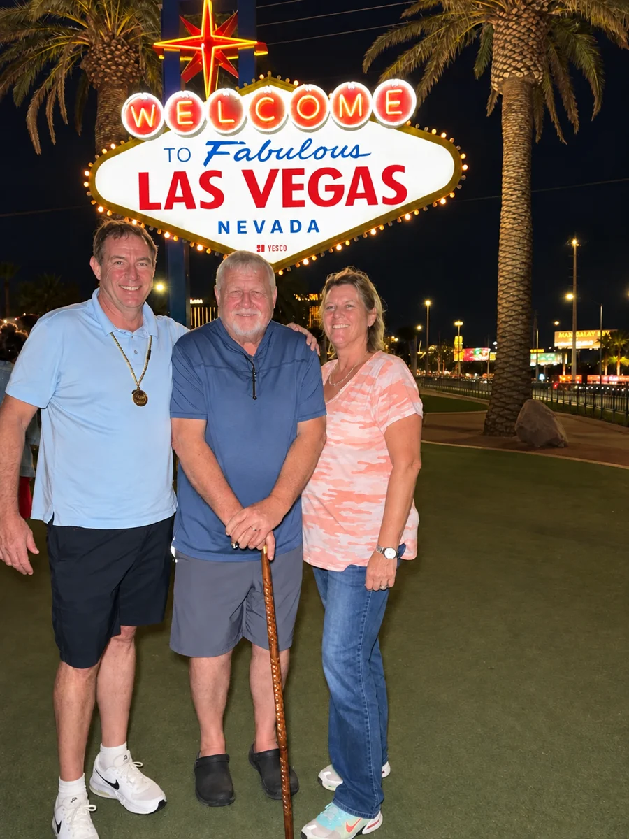 Christopher Duncan with his dad, Wallace, and Staci in front of the Welcome to Las Vegas sign